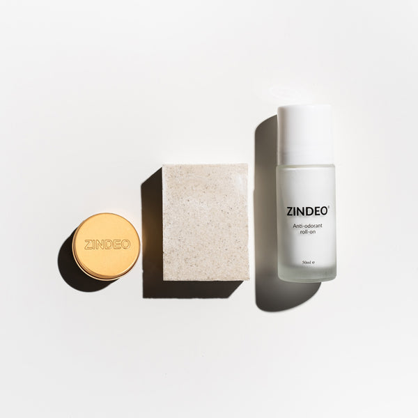 Zindeo anti-odorant roll-on and packaging on a white background